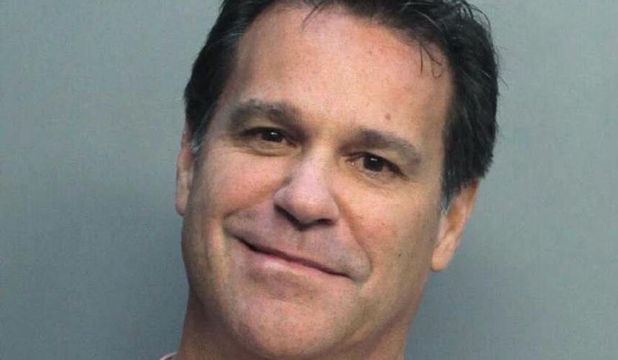 This Jan. 21, 2019 photo provided by the Miami Dade Department of Corrections shows Mark Allen Bartlett. On Tuesday, Feb. 19, 2019, the Miami-Dade County state attorney's office said that Bartlett is charged with three counts of aggravated assault with prejudice and two firearms counts. The hate crime charges stem from an incident when Bartlett got into a traffic confrontation with a group of black teenagers protesting housing inequality. (Miami Dade Dept. of Corrections via AP)