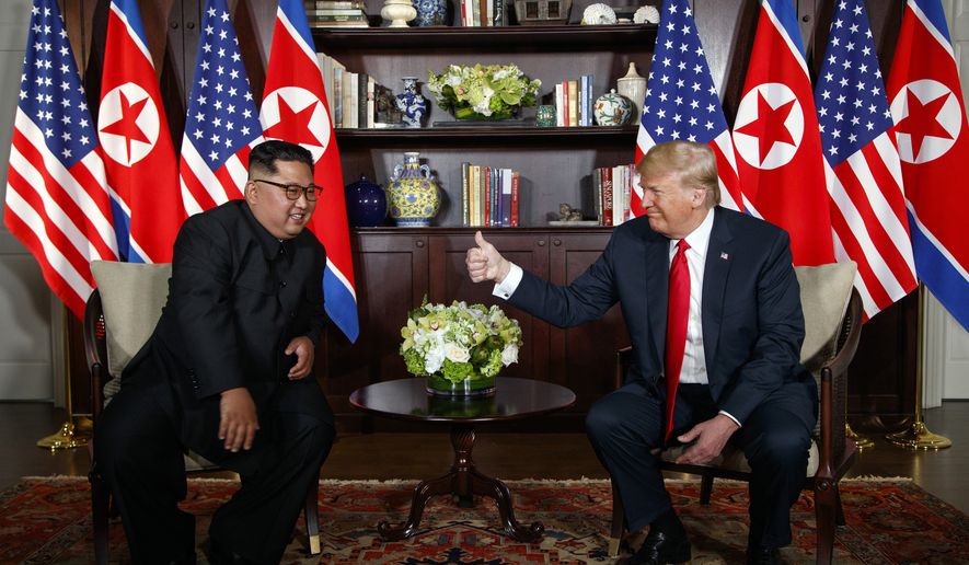 In this June 12, 2018 file photo, President Donald Trump meets with North Korean leader Kim Jong Un on Sentosa Island, Tuesday, June 12, 2018, in Singapore.  (AP Photo/Evan Vucci) **FILE**