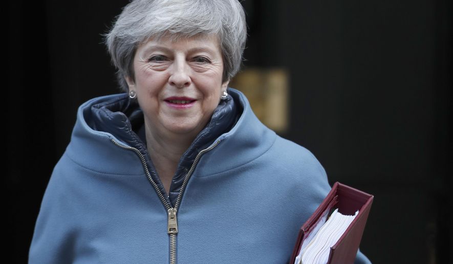 Britain's Prime Minister Theresa May leaves 10 Downing Street for the House of Commons for her weekly Prime Minister's Questions in London, Wednesday, Feb. 20, 2019. May is due to go the Brussels to meet EU leaders for further negotiation on Brexit. (AP Photo/Alastair Grant)