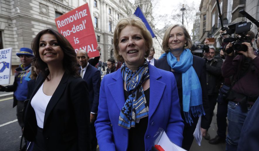 British politicians Heidi Allen, left, Anna Soubry, center, and Sarah Wollaston, right, arrive for a press conference in Westminster in London, Wednesday, Feb. 20, 2019. Cracks in Britain's political party system yawned wider Wednesday, as three pro-European lawmakers — Soubry, Allen and Wollaston — quit the governing Conservatives to join a newly formed centrist group of independents who are opposed to the government's plan for Britain's departure from the European Union. (AP Photo/Kirsty Wigglesworth)