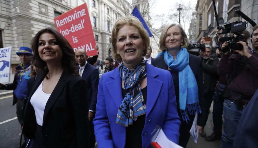 British politicians Heidi Allen, left, Anna Soubry, center, and Sarah Wollaston, right, arrive for a press conference in Westminster in London, Wednesday, Feb. 20, 2019. Cracks in Britain's political party system yawned wider Wednesday, as three pro-European lawmakers — Soubry, Allen and Wollaston — quit the governing Conservatives to join a newly formed centrist group of independents who are opposed to the government's plan for Britain's departure from the European Union. (AP Photo/Kirsty Wigglesworth)