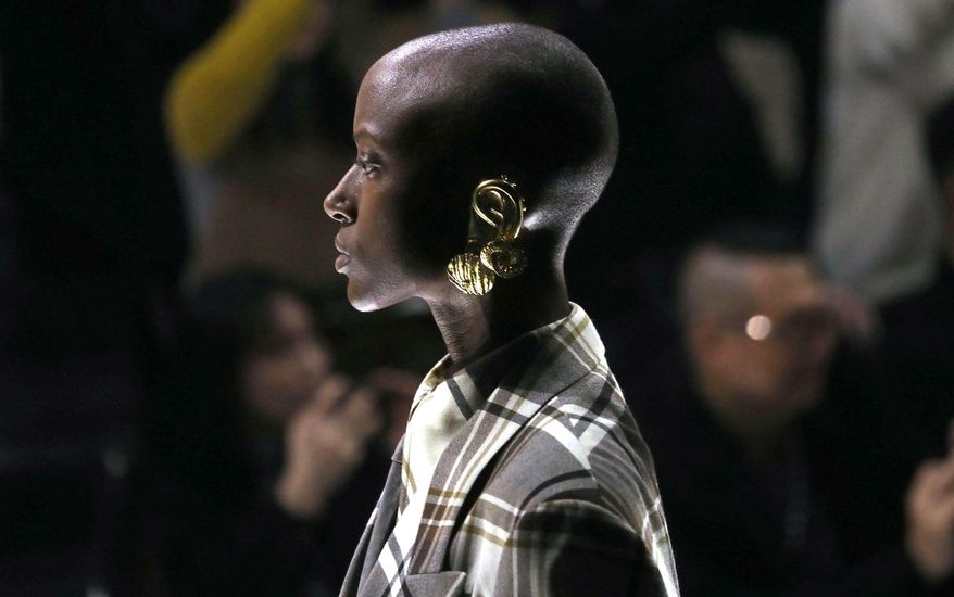 A model presents a creation by Gucci women's fall-winter 2019-2020 collection, during the Milan Fashion Week, in Milan, Italy, Wednesday, Feb. 20, 2019. (Matteo Bazzi/ANSA via AP)