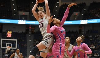 Connecticut&#x27;s Katie Lou Samuelson, left, grabs a rebound over Memphis&#x27; Ashia Jones, right, during the first half of an NCAA college basketball game, Wednesday, Feb. 20, 2019, in Hartford, Conn. (AP Photo/Jessica Hill)
