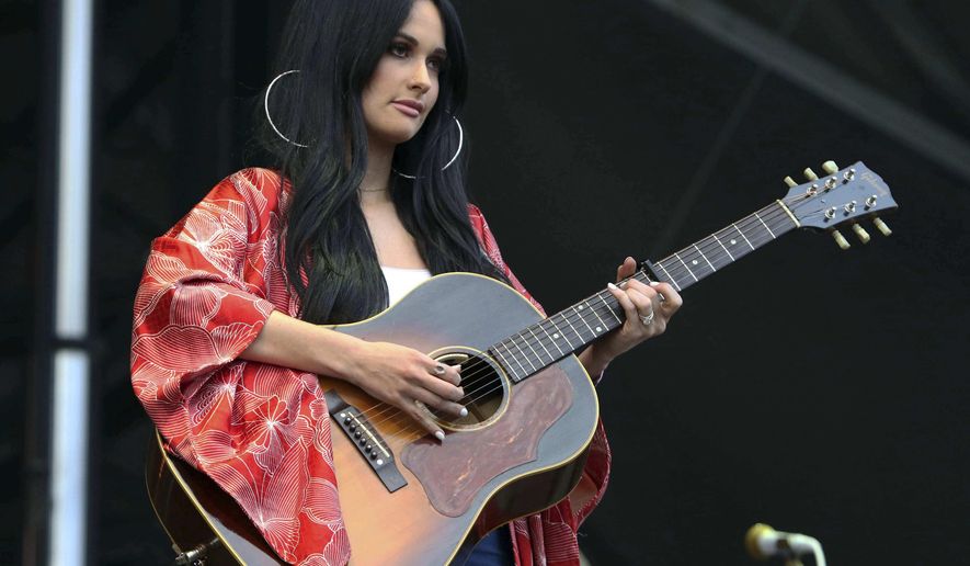 FILE - In this Sept. 15, 2018 file photo, Kacey Musgraves performs during Music MidTown 2018 at Piedmont Park, in Atlanta. Chris Stapleton, Dan + Shay lead the 54th Academy of Country Music Awards with six nominations each while Grammy album of the year winner Musgraves comes in with five nominations. Reba McEntire, who is hosting the show for a record 16th time, announced the nominees in top categories on “CBS This Morning” on Wednesday, Feb. 20, 2019. (Photo by Katie Darby/Invision/AP, File)