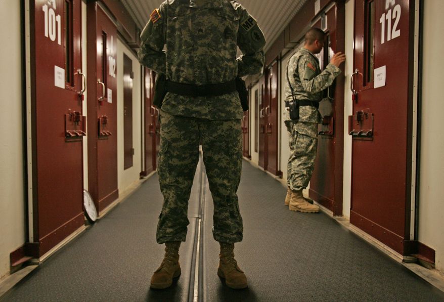 In this Oct. 9, 2007, file photo, reviewed by a U.S. Dept of Defense official, U.S. military personnel inspect each occupied cell on a two-minute cycle at Camp 5 maximum-security facility on the Guantanamo Bay U.S. Naval Base in Cuba. An effort to decrease the detainee population appears to have bogged down as authorities wrestle with what to do with those who cannot easily be brought to trial but are considered too dangerous to free, and others who have been cleared for release but can&amp;#8217;t be sent to their home countries. (AP Photo/Brennan Linsley, File)