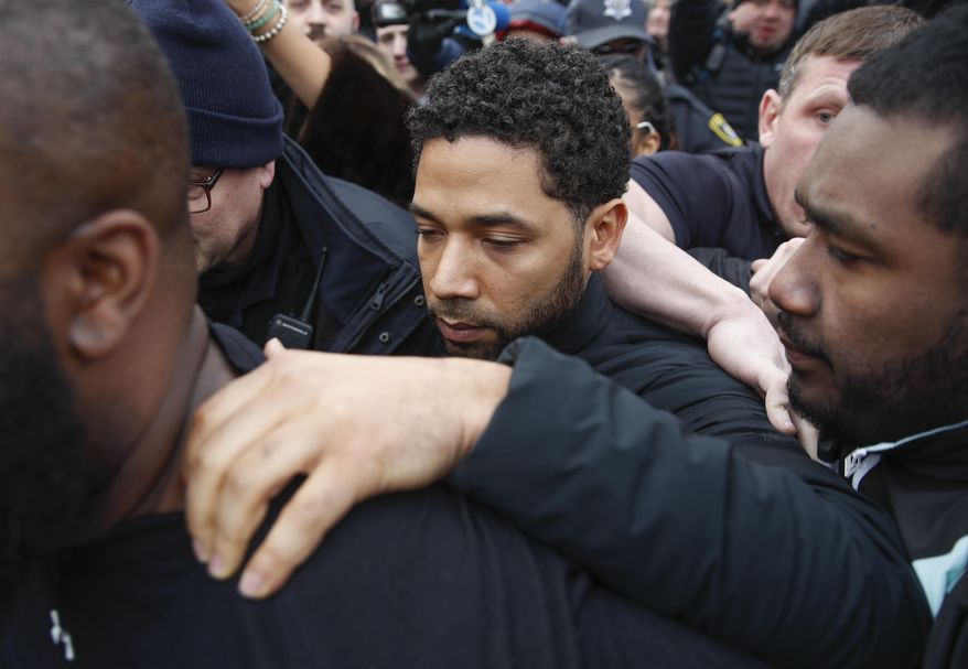"Empire" actor Jussie Smollett leaves Cook County jail following his release, Thursday, Feb. 21, 2019, in Chicago. Smollett was charged with disorderly conduct and filling a false police report when he said he was attacked in downtown Chicago by two men who hurled racist and anti-gay slurs and looped a rope around his neck, a police official said. (AP Photo/Kamil Krzaczynski)