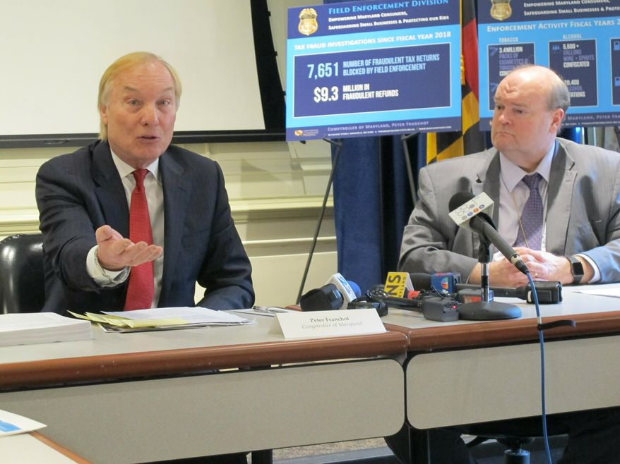 Maryland Comptroller Peter Franchot, left, criticizes legislation that would remove regulatory powers over alcohol, tobacco and gasoline from his office during a news conference on Thursday, Feb. 21, 2019 in Annapolis, Md. Jeff Kelly, right, director of the Field Enforcement Division in the comptroller's office, listens. (AP PHoto/Brian Witte)