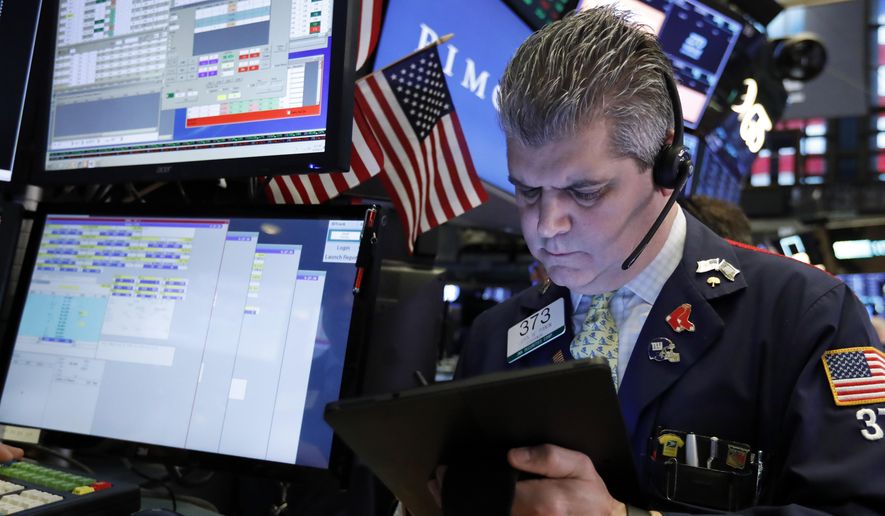 FILE- In this Feb. 15, 2019, file photo trader John Panin works on the floor of the New York Stock Exchange. The U.S. stock market opens at 9:30 a.m. EST on Thursday, Feb. 21. (AP Photo/Richard Drew, File)