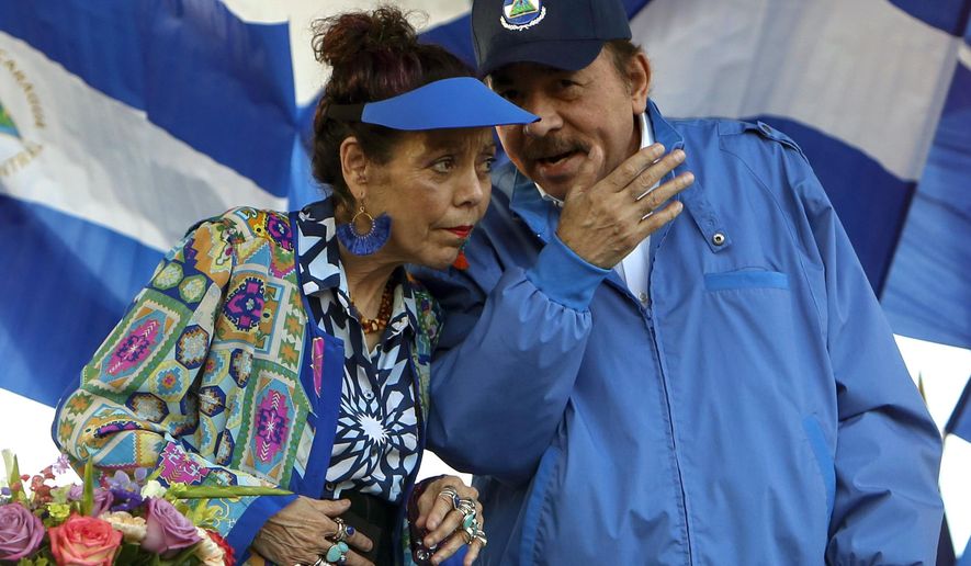 FILE - In this Sept. 5, 2018 file photo, Nicaragua's President Daniel Ortega and his wife and Vice President Rosario Murillo, lead a rally in Managua, Nicaragua. Ortega said Thursday, Feb. 21, 2019, that he will restart talks with his opponents, more than six months after breaking off the last dialogue and unleashing a round of arrests. (AP Photo/Alfredo Zuniga, File)