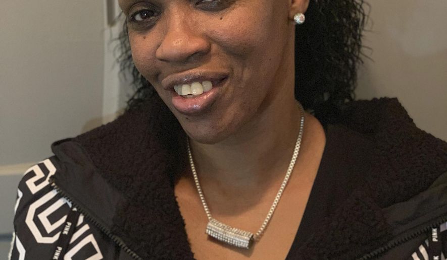 In this photo provided by Lois Martin, Christal Fields, 53, poses for a photograph in Seattle on Thursday, Jan. 21, 2019, after the Washington state Supreme Court ruled that a decades-old conviction for purse-snatching could not automatically bar her from becoming a child-care worker. The majority said the state must have a hearing to consider her qualifications. (Lois Martin via AP)