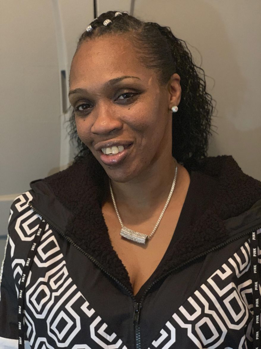 In this photo provided by Lois Martin, Christal Fields, 53, poses for a photograph in Seattle on Thursday, Jan. 21, 2019, after the Washington state Supreme Court ruled that a decades-old conviction for purse-snatching could not automatically bar her from becoming a child-care worker. The majority said the state must have a hearing to consider her qualifications. (Lois Martin via AP)