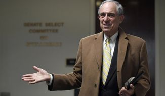Michael Cohen&#39;s attorney, Lanny Davis, talks with reporters on Capitol Hill in Washington, Thursday, Feb. 21, 2019. (AP Photo/Susan Walsh)