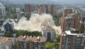 Clouds of dust rise from the implosion of a six-floor apartment building that former cartel boss Pablo Escobar once called home, in Medellin, Colombia, Friday, Feb. 22, 2019. Mayor Federico Gutierrez had been pushing to raze the building and erect in its place a park honoring the thousands of victims, including four presidential candidates and some 500 police officers, killed by Escobar&#x27;s army of assassins during the Medellin cartel&#x27;s heyday in the 1980s and 1990s. (AP Photo/Luis Benavidez)
