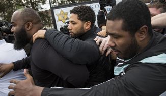 &amp;quot;Empire&amp;quot; actor Jussie Smollett, center, leaves Cook County jail following his release, Thursday, Feb. 21, 2019, in Chicago. Smollett was charged with disorderly conduct and filling a false police report when he said he was attacked in downtown Chicago by two men who hurled racist and anti-gay slurs and looped a rope around his neck, a police official said. (Ashlee Rezin/Chicago Sun-Times via AP)