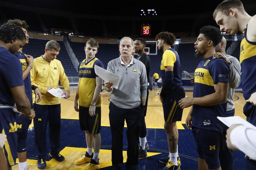 Michigan head basketball coach John Beilein talks during practice in Ann Arbor, Mich., Tuesday, Feb. 19, 2019. Beilein and Michigan State's Tom Izzo are friendly rivals, whose highly ranked NCAA college basketball teams will play for the first time this season on Sunday at Crisler Arena. As much as Beilein and Izzo genuinely like and respect each other, the highly competitive coaches want to win. (AP Photo/Paul Sancya)