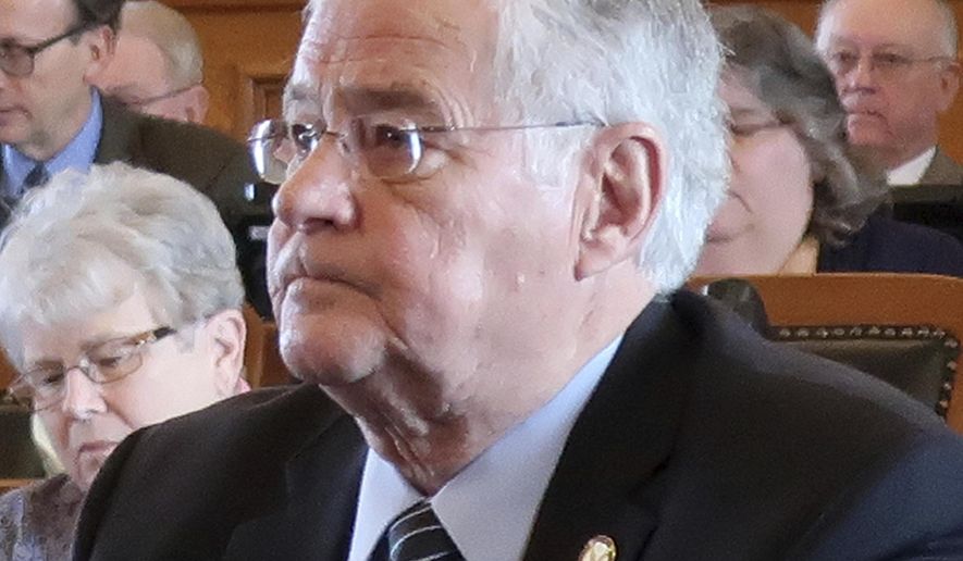 Kansas state Rep. Ron Highland, R-Wamego, sits at his desk during the House's session, Friday, Feb. 22, 2019, at the Statehouse, in Topeka, Kan. Highland has apologized for sponsoring an anti-same-sex marriage bill after his LGBTQ daughter criticized it in a letter posted on Facebook, ending with, "Shame on you." (AP Photo/John Hanna)