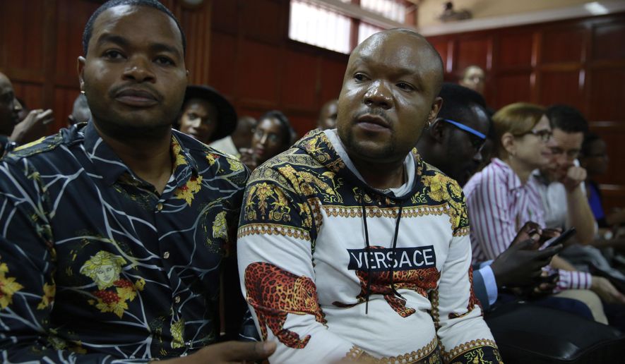 LGBT supporters wait at the Milimani court for the Kenyan court ruling on whether to decriminalize same sex relationships, in Nairobi, Kenya, Friday, Feb. 22, 2019. A Kenyan judge says the High Court has postponed a ruling on a petition to decriminalize same sex relationships. The decision has left the tens of the activists who turned up in court disappointed. (AP Photo/Brian Inganga) .
