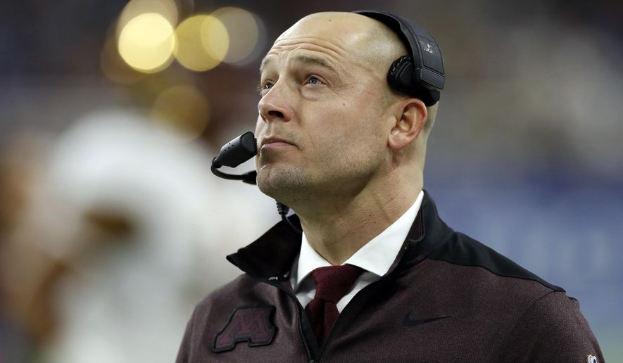 FILE - In this Dec. 26, 2018, file photo, Minnesota head coach P.J. Fleck walks on the sidelines during the Quick Lane Bowl NCAA college football game against Georgia Tech in Detroit. Former Minnesota coach Jerry Kill says he won't speak again to P.J. Fleck, saying the current Golden Gophers coach is too selfish. Kill spoke to Sirius XM radio Tuesday, Feb 19, 2019, and said he thinks Fleck is "about himself" instead of the players . (AP Photo/Carlos Osorio, File)
