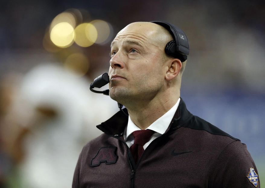 FILE - In this Dec. 26, 2018, file photo, Minnesota head coach P.J. Fleck walks on the sidelines during the Quick Lane Bowl NCAA college football game against Georgia Tech in Detroit. Former Minnesota coach Jerry Kill says he won't speak again to P.J. Fleck, saying the current Golden Gophers coach is too selfish. Kill spoke to Sirius XM radio Tuesday, Feb 19, 2019, and said he thinks Fleck is "about himself" instead of the players . (AP Photo/Carlos Osorio, File)