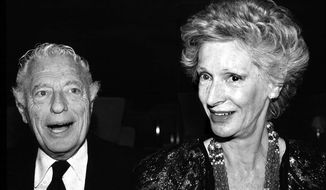 FILE - Giovanni Agnelli and his wife Marella Caracciolo are shown in this 1988 file photo. Italian state TV and news agency ANSA say Marella Agnelli, widow of Fiat tycoon Gianni Agnelli and a 20th-century symbol of elegant beauty and culture in Italy, has died at her family home in Turin, in the northern Piedmont region, at age 91.  (AP Photo/Alberto Ramella, File)