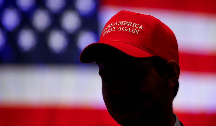 The MAGA hat worn by President Trump&#39;s supporters has triggered angry confrontations and political violence across the U.S. with alarming frequency. (Associated Press) ** FILE **