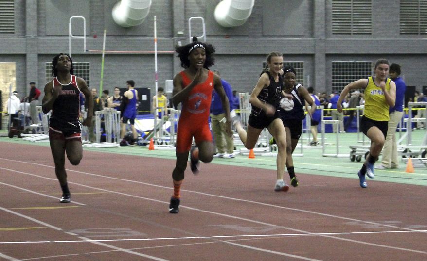 In this Thursday, Feb. 7, 2019 photo, Bloomfield High School transgender athlete Terry Miller, second from left, wins the final of the 55-meter dash over transgender athlete Andraya Yearwood, left, and other runners in the Connecticut girls Class S indoor track meet at Hillhouse High School in New Haven, Conn. In the track-and-field community in Connecticut, the dominance of Miller and Yearwood has stirred resentment among some competitors and their families. (AP Photo/Pat Eaton-Robb)