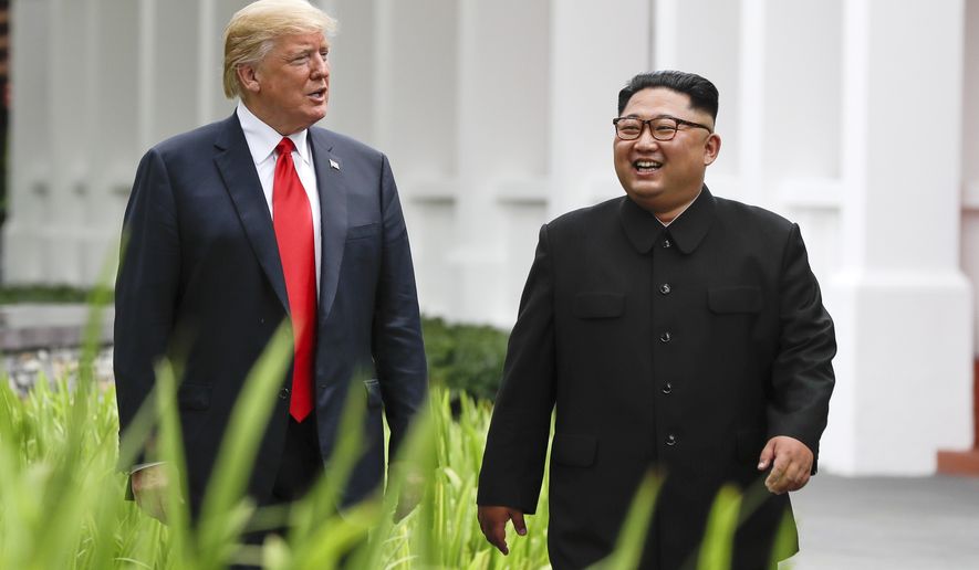 FILE - In this June 12, 2018, file photo, U.S. President Donald Trump, left, and North Korea leader Kim Jong Un walk from their lunch at the Capella resort on Sentosa Island in Singapore. The success of the second summit between President Donald Trump and North Korean leader Kim Jong Un hinges largely on whether Kim proves he’s truly committed to denuclearization. (AP Photo/Evan Vucci, File)