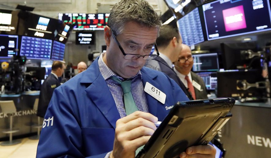 FILE- In this Feb. 8, 2019, file photo trader Daniel Trimble works on the floor of the New York Stock Exchange. The U.S. stock market opens at 9:30 a.m. EST on Monday, Feb. 25. (AP Photo/Richard Drew, File)