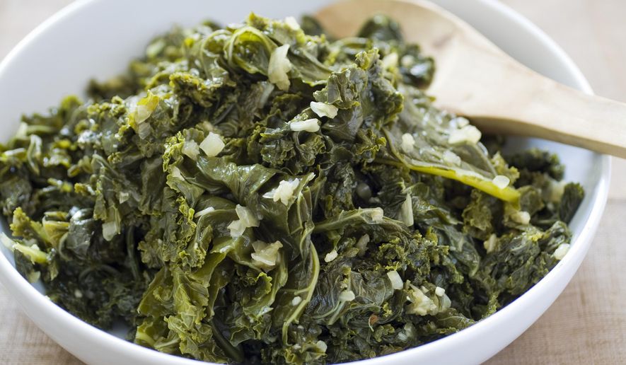 This undated photo provided by America's Test Kitchen in February 2019 shows Garlicky Braised Kale in Brookline, Mass. This recipe appears in the cookbook “How to Braise Everything.” (Carl Tremblay/America's Test Kitchen via AP)