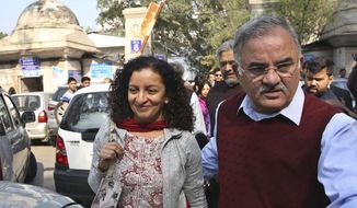 Indian journalist Priya Ramani, left, smiles as she leaves Patiala House Court in New Delhi, India, Monday, Feb. 25, 2019. A journalist sued for defamation after accusing former Indian minister and veteran news editor M.J. Akbar of sexual harassment has been granted bail in a New Delhi court. (AP Photo)