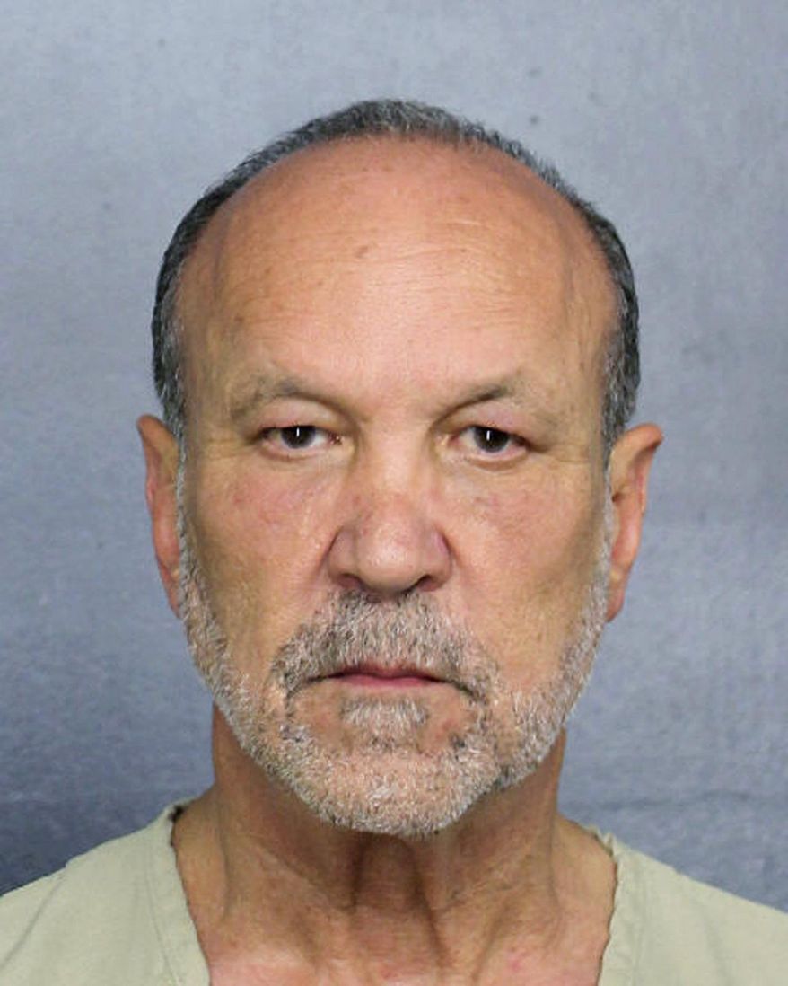 In this Feb. 24, 2019 photo made available by the Broward County Sheriff's Office, Fla., shows Ron Book under arrest. Book, a prominent lobbyist, is facing drunk-driving charges after an accident Sunday, Feb. 24, where property damage was recorded. (Broward County Sheriff's Office via AP)