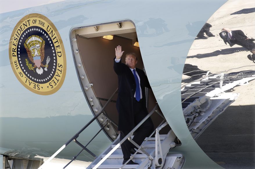 President Donald Trump waves as he boards Air Force One for a trip to Vietnam to meet with North Korean leader Kim Jong Un, Monday, Feb. 25, 2019, in Andrews Air Force Base, Md. (AP Photo/ Evan Vucci)