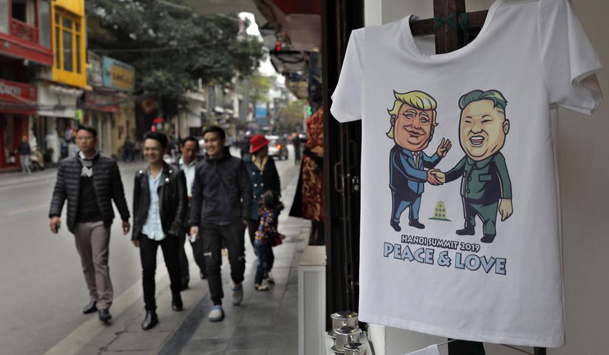 A T-shirt with images of U.S. President Donald Trump and North Korean leader Kim Jong Un is displayed at a tourist area in Hanoi, Vietnam, Sunday, Feb. 24, 2019. As Vietnam's capital gears up for the second summit between U.S. President Donald Trump and North Korean leader Kim Jong Un, people leave offerings at temples, snap selfies and buy snacks in Hanoi. (AP Photo/Vincent Yu)