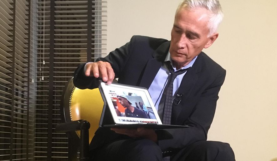 Univision’s Jorge Ramos shows a video he says his crew shot the previous day showing Venezuelan youth picking food scraps out of the back of a garbage truck in Caracas, during an interview at a hotel in Caracas, Venezuela, Monday, Feb. 25, 2019. According to Ramos, Venezuelan President Nicolas Maduro cut short an interview when he showed Maduro the same footage during the interview at Miraflores presidential palace, before leaving two hours later without having his crew&#39;s equipment returned. (AP Photo)