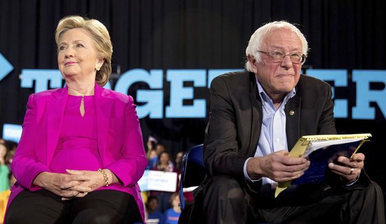 In this Nov. 3, 2016, file photo, Democratic presidential candidate Hillary Clinton and Sen. Bernie Sanders, D-Vt., appear at a rally at Coastal Credit Union Music Park at Walnut Creek in Raleigh, N.C. The tension between supporters of Bernie Sanders and Hillary Clinton resurfaced on Tuesday after the Vermont senator announced his second run for the White House. (AP Photo/Andrew Harnik) ** FILE **