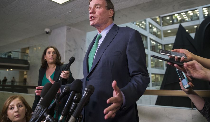 Sen. Mark Warner, D-Va., speaks after hearing some of the testimony from Michael Cohen, President Donald Trump&#39;s former lawyer, before a closed door hearing of the Senate Intelligence Committee on Capitol Hill, Tuesday, Feb. 26, 2019, in Washington. (AP Photo/Alex Brandon)