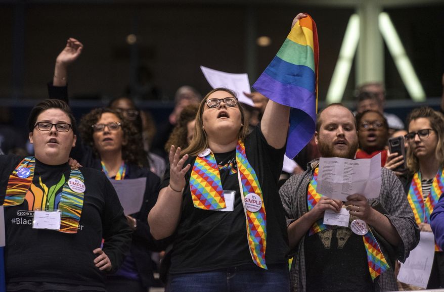 In this file photo, Shelby Ruch-Teegarden, center, of Garrett-Evangelical Theological Seminary joins other protestors during the United Methodist Church&#39;s special session of the general conference in St. Louis, Tuesday, Feb. 26, 2019. America&#39;s second-largest Protestant denomination has canceled its 2020 general conference due to the coronavirus emergency. The denomination was supposed to deliberate on a plan to split in two denominations in light of irreconcilable theological differences related to sexual ethics. (AP Photo/Sid Hastings) **FILE**