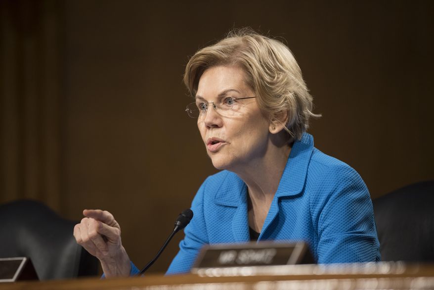 Sen. Elizabeth Warren, D-Mass., questions Federal Reserve Chairman Jerome Powell during a hearing of the Senate Banking, Housing and Urban Affairs Committee on Tuesday, Feb. 26, 2019, in Washington. (AP Photo/Kevin Wolf)