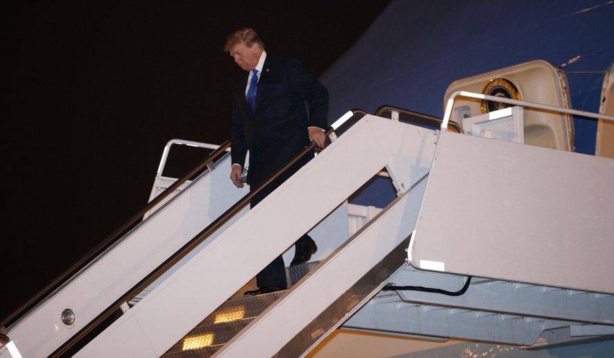 U.S President Donald Trump arrives at Noi Bai Airport before a summit with North Korean leader Kim Jong Un, Tuesday, Feb. 26, 2019, in Hanoi. (AP Photo/ Evan Vucci)