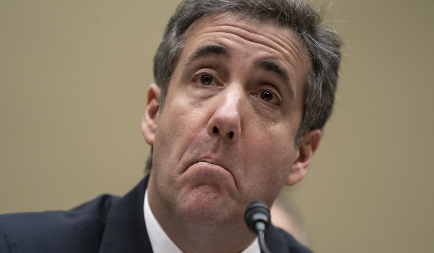 Michael Cohen, President Donald Trump&#39;s former personal lawyer, reads an opening statement as he testifies before the House Oversight and Reform Committee on Capitol Hill in Washington, Wednesday, Feb. 27, 2019.  (AP Photo/J. Scott Applewhite)