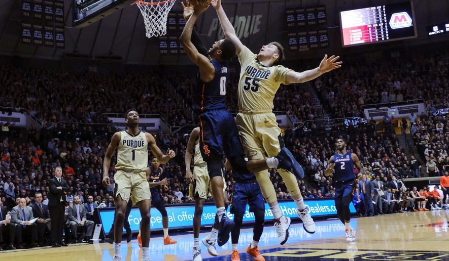 Purdue guard Sasha Stefanovic (55) fouls Illinois guard Alan Griffin (0) during the first half of an NCAA college basketball game in West Lafayette, Ind., Wednesday, Feb. 27, 2019. (AP Photo/AJ Mast)