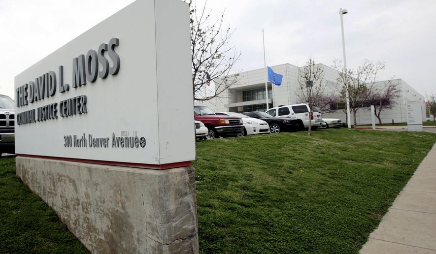 This Wednesday, April 17, 2013 photo shows the exterior of the David L. Moss Criminal Justice Center, in Tulsa, Okla. Tulsa County will pay $350,000 to the family of an inmate who killed himself in the county jail 10 years ago (Cory Young/Tulsa World via AP)