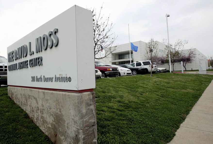 This Wednesday, April 17, 2013 photo shows the exterior of the David L. Moss Criminal Justice Center, in Tulsa, Okla. Tulsa County will pay $350,000 to the family of an inmate who killed himself in the county jail 10 years ago (Cory Young/Tulsa World via AP)