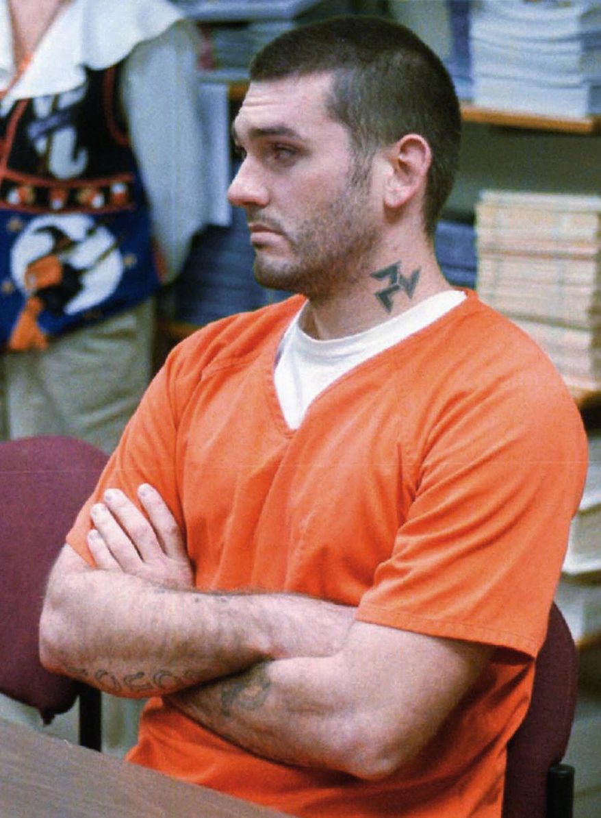 FILE - In this Oct. 31 1997, file photo, Danny Lee waits for his arraignment hearing for the 1996 murders of an Arkansas family in Russellville, Ark. Lee's request for a new trial in a 1999 federal murder conviction and death sentence in Arkansas has been denied, with the judge saying he doesn't have jurisdiction while noting that evidence presented by attorneys "is reasonably likely" to have led in a different sentence. (Dan Pierce/The Courier via AP, File)