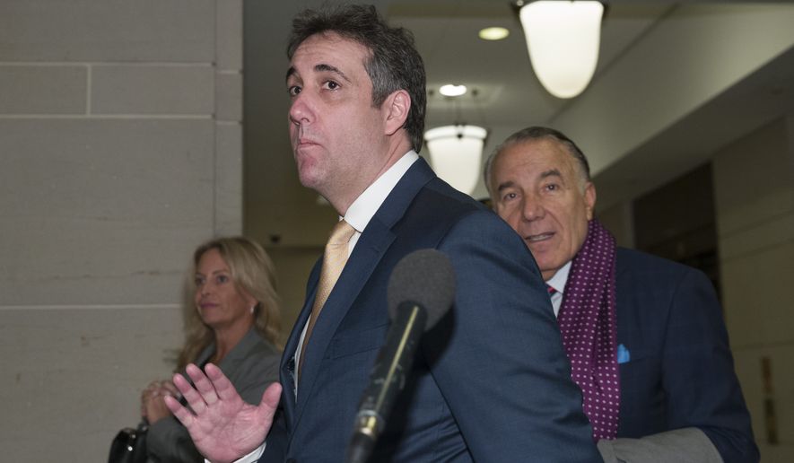 Michael Cohen, center, President Donald Trump&#39;s former lawyer, arrives to testify before a closed-door hearing of the House Intelligence Committee accompanied by his lawyer, Michael Monico of Chicago, on Capitol Hill, Thursday, Feb. 28, 2019, in Washington. (AP Photo/Alex Brandon)