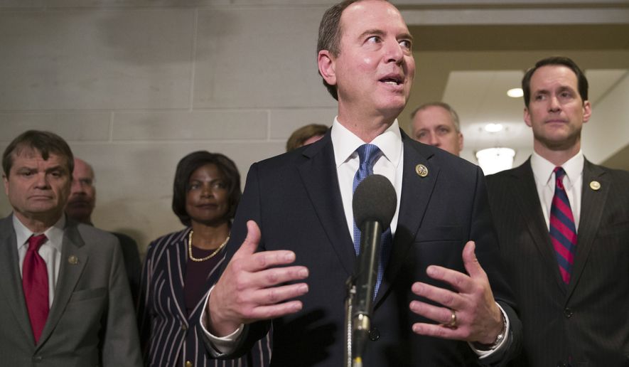 House Intelligence Committee Chairman Adam Schiff, of Calif., accompanied by fellow Democratic members of the committee, talks with the media after hearing Michael Cohen, President Donald Trump&#x27;s former lawyer, testify before a closed-door hearing of the House Intelligence Committee, on Capitol Hill, Thursday, Feb. 28, 2019, in Washington. (AP Photo/Alex Brandon)