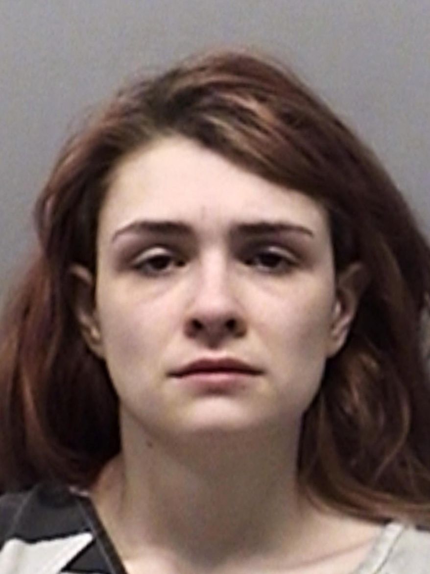 FILE - This undated photo provided by the From Wise County Sheriff's Office shows Paige Isabow Harkings. A North Texas judge says four young siblings will remain in foster care after two were discovered locked in a dog cage and the others were found smeared with excrement in a barn. Harkings has been jailed on child endangerment charges The judge ruled Wednesday, Feb. 27, 2019, that no suitable relatives could be found to care for the children, who range in age from 1 to 5 years old. ( Wise County Sheriff's Office via AP, File)