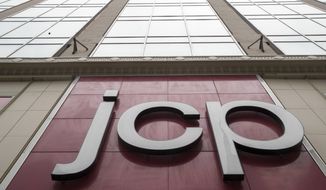 FILE - In this May 16, 2018, file photo, the J.C. Penney logo is seen hanging outside the Manhattan mall in New York. J.C. Penney Co. reports financial results Thursday, Feb. 28, 2019. (AP Photo/Mary Altaffer, File)
