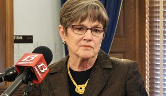 FILE - In this Feb 14, 2019 file photo, Kansas Gov. Laura Kelly ponders a question during a news conference at the Statehouse in Topeka, Kan. Kansas lawmakers have hit the halfway point of their annual session and the GOP-dominated Legislature doesn&#39;t just appear to be slow-walking new Democratic Gov. Laura Kelly&#39;s big initiatives. Despite Republican supermajorities, an income tax relief bill that GOP leaders consider an urgent priority hasn&#39;t cleared both chambers. (AP Photo/John Hanna, File)