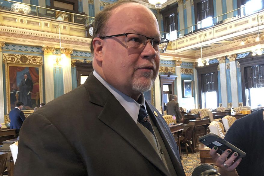 State Sen. Jim Runestad, R-White Lake Township, speaks with reporters after the passage of his bill to combat mail theft on Thursday, Feb. 28, 2019, at the Capitol in Lansing, Mich. The Senate voted unanimously Thursday to send two bills to the House that would make the theft of mail and packages a state crime. Law enforcement says U.S. postal inspectors are currently overwhelmed with investigating what is a federal crime. (AP Photo/David Eggert)